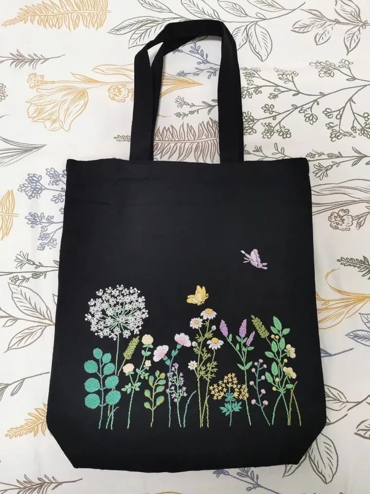 Black tote bag with colourful flowers and butterflies