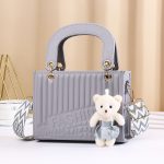 Women Fashion Casual Solid Color Rhombic Pattern Bear Pendat Handbag - Image 11