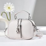 Wholesale Women Fashion Simple Solid Color Bear Pendant Handbag - Image 3