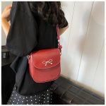 Wholesale Fashion Solid Color Bow Flip Mini Crossbody Bag - Image 4