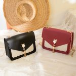Wholesale Women Chic Flap Buckle Design Cat Tassel Decoration Color Blocking PU Crossbody Bag