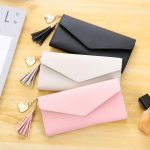Wholesale Women Fashion Solid Color Flip Tassel Pendant Long Purses