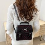 Wholesale Women Fashion Casual Printed Bowknot Buckle Canvas Backpack