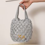 Stylish Woven Bucket Bag with Metallic Accents - Image 7