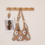 Chic Woven Shoulder Bag with Floral Design