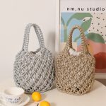 Stylish Woven Bucket Bag with Metallic Accents