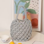 Stylish Woven Bucket Bag with Metallic Accents - Image 2