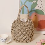 Stylish Woven Bucket Bag with Metallic Accents - Image 3
